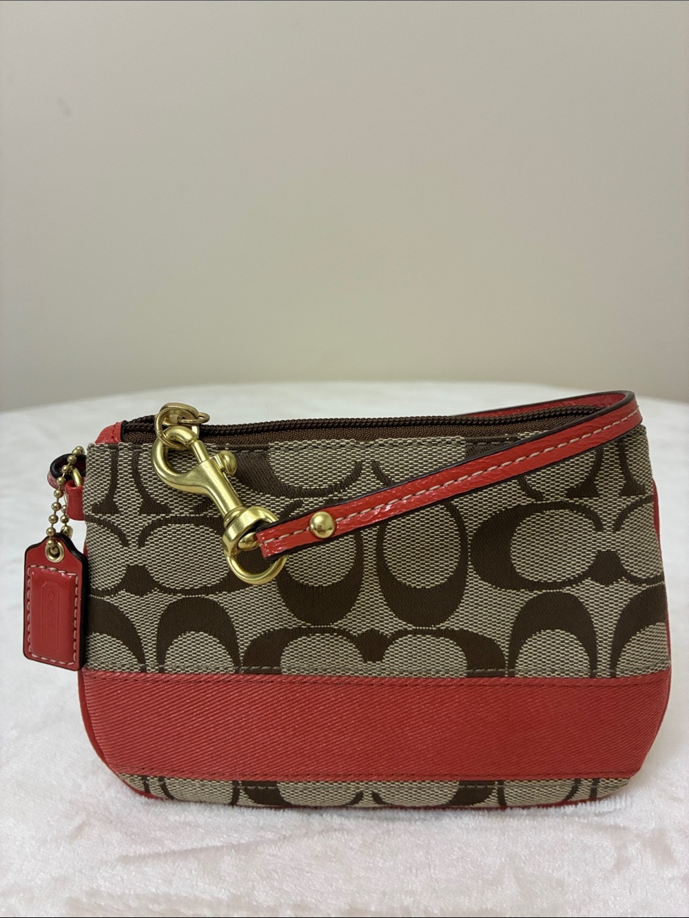 NWOT Coach Signature Canvass Wristlet in Brown and Coral Trim
